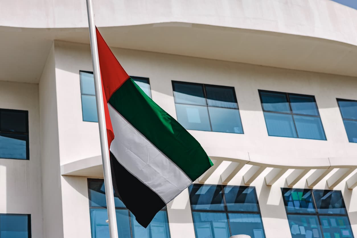 UAE embassy building with national flag representing UAE Embassy Attestation and document authentication process for use in the United Arab Emirates